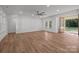 Spacious living room with hardwood floors and a glass door leading to the backyard at 108 Woodwinds St, Locust, NC 28097