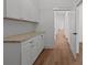 Spacious pantry features white cabinets with ample storage and counter space at 108 Woodwinds St, Locust, NC 28097