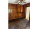 Charming bedroom with wooden paneling and built in storage. Beautiful original hardwood flooring at 11204 Williams Rd, Mint Hill, NC 28227