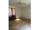 Bedroom featuring neutral walls, a ceiling fan, and good natural light ready for renovation at 11204 Williams Rd, Mint Hill, NC 28227