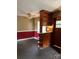 Dining area with wood paneling and a retro built-in bar feature at 11204 Williams Rd, Mint Hill, NC 28227