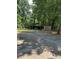 A wooden shed with an open front provides extra storage and parking for vehicles at 11204 Williams Rd, Mint Hill, NC 28227