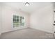 Bedroom with carpet, trim, and window providing natural light at 1189 Quiet Acres Rd, Rock Hill, SC 29732