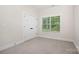 Bedroom with carpet, trim, and window providing natural light at 1189 Quiet Acres Rd, Rock Hill, SC 29732
