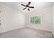 Bedroom with carpet, trim, ceiling fan, and window providing natural light at 1189 Quiet Acres Rd, Rock Hill, SC 29732