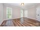 Bright bedroom features hardwood floors, trim, and windows providing natural light at 1189 Quiet Acres Rd, Rock Hill, SC 29732