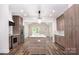 Modern kitchen featuring an island, stainless steel appliances, custom cabinets, and hardwood floors at 1189 Quiet Acres Rd, Rock Hill, SC 29732