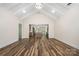 Open-concept living room with vaulted ceilings, hardwood floors, and seamless flow to the kitchen at 1189 Quiet Acres Rd, Rock Hill, SC 29732