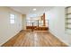 Bright living room boasts wood laminate flooring, staircase, and neutral paint at 1295 Reservation Rd, Rock Hill, SC 29730
