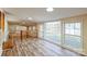 Bright living room boasts wood laminate flooring, large picture windows, and neutral paint at 1295 Reservation Rd, Rock Hill, SC 29730