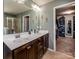 Elegant bathroom featuring double sinks, a large mirror, and a walk-in shower at 134 Cherry Bark Dr, Mooresville, NC 28117