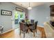 Cozy dining area featuring a glass table, cushioned chairs, and sliding door access to the outdoor patio at 134 Cherry Bark Dr, Mooresville, NC 28117
