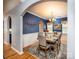 Elegant dining room with blue walls, a large table set for six, and decorative wainscoting detail at 134 Cherry Bark Dr, Mooresville, NC 28117