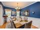 Sophisticated dining area with stylish lighting, a dark wood table, and tasteful decor for elegant meals at 134 Cherry Bark Dr, Mooresville, NC 28117