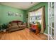 Comfortable office featuring wood floors, a cozy couch, and a large window to maximize natural light at 134 Cherry Bark Dr, Mooresville, NC 28117