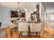 Modern kitchen with granite countertops, stainless steel appliances, and a breakfast bar with stylish seating at 134 Cherry Bark Dr, Mooresville, NC 28117