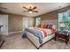 Relaxing main bedroom featuring a bed with a cushioned headboard, bedside tables, and windows providing natural light at 134 Cherry Bark Dr, Mooresville, NC 28117