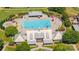 Aerial view of the community pool and clubhouse, surrounded by lush landscaping and lounge chairs at 134 Cherry Bark Dr, Mooresville, NC 28117