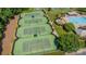 Overhead shot showcases well-maintained community tennis courts near pool, perfect for active residents at 134 Cherry Bark Dr, Mooresville, NC 28117