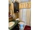 This bathroom features a vintage sink and a matching dark green counter at 1341 Pleasant Hill Church Rd, Wadesboro, NC 28170