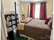Here is another view of the bedroom with a bookshelf full of books at 1341 Pleasant Hill Church Rd, Wadesboro, NC 28170