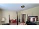 This bedroom has a four post bed and a black bookshelf at 1341 Pleasant Hill Church Rd, Wadesboro, NC 28170