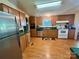Bright kitchen with stainless steel appliances and natural oak cabinetry at 1341 Pleasant Hill Church Rd, Wadesboro, NC 28170
