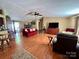 Bright living room featuring hardwood floors, a cozy fireplace, and neutral paint at 1341 Pleasant Hill Church Rd, Wadesboro, NC 28170