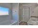 Bright bathroom features a soaking tub, shower, window, granite countertops, and a double vanity at 159 Apple Orchard Ct, Statesville, NC 28677