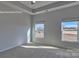 This bedroom features neutral paint, carpet, and a double window letting in natural light at 159 Apple Orchard Ct, Statesville, NC 28677