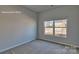 Comfortable bedroom featuring plush carpeting and a bright window at 159 Apple Orchard Ct, Statesville, NC 28677
