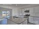 Updated kitchen featuring granite counters, stainless steel appliances, and a center island at 159 Apple Orchard Ct, Statesville, NC 28677