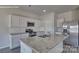 Modern kitchen featuring white cabinets, stainless steel appliances, granite counters, and a functional center island at 159 Apple Orchard Ct, Statesville, NC 28677