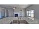 Modern kitchen with granite countertops, stainless steel appliances, open layout with view of living area at 159 Apple Orchard Ct, Statesville, NC 28677