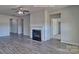 A spacious living room showcases an electric fireplace and seamlessly connect to other areas in the home at 159 Apple Orchard Ct, Statesville, NC 28677