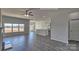 Open-concept living room with wood-style flooring, lots of natural light, and seamless flow to the kitchen at 159 Apple Orchard Ct, Statesville, NC 28677