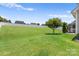 Expansive backyard featuring lush lawn and privacy fence providing outdoor space at 159 E Warfield Dr, Mooresville, NC 28115