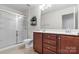 Bathroom featuring double sink vanity, shower with glass door and tile flooring at 159 E Warfield Dr, Mooresville, NC 28115