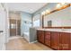 Bathroom featuring a double vanity, soaking tub, and glass-enclosed shower at 159 E Warfield Dr, Mooresville, NC 28115