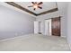 Bedroom featuring a ceiling fan and a sliding barn door at 159 E Warfield Dr, Mooresville, NC 28115