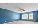 Bedroom featuring two windows, neutral carpet, and blue walls at 159 E Warfield Dr, Mooresville, NC 28115