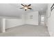 Bonus room featuring a ceiling fan and neutral carpet at 159 E Warfield Dr, Mooresville, NC 28115