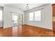 Bright dining area featuring hardwood floors and a sliding door leading to an outdoor patio at 159 E Warfield Dr, Mooresville, NC 28115
