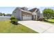 Beautiful home featuring a driveway, a two car garage, stone accents and meticulously landscaped yard at 159 E Warfield Dr, Mooresville, NC 28115