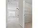 Hallway view to bedroom with ceiling fan and closet with wire shelving at 159 E Warfield Dr, Mooresville, NC 28115
