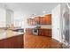 Well-appointed kitchen with wood cabinets, stainless appliances, granite counters, and an open layout at 159 E Warfield Dr, Mooresville, NC 28115