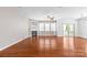 Bright living room features hardwood floors, a fireplace, large windows and a sliding door to the backyard at 159 E Warfield Dr, Mooresville, NC 28115