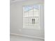 Window with blinds allowing natural light into the room with carpeted floor at 159 E Warfield Dr, Mooresville, NC 28115