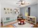 Cozy Bedroom featuring a rocking chair, and a crib, creating a warm and inviting space for a little one at 160 Walking Horse Run, Stanley, NC 28164