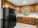 Charming kitchen equipped with appliances, and plentiful cabinetry, blending functionality with a cozy aesthetic at 160 Walking Horse Run, Stanley, NC 28164